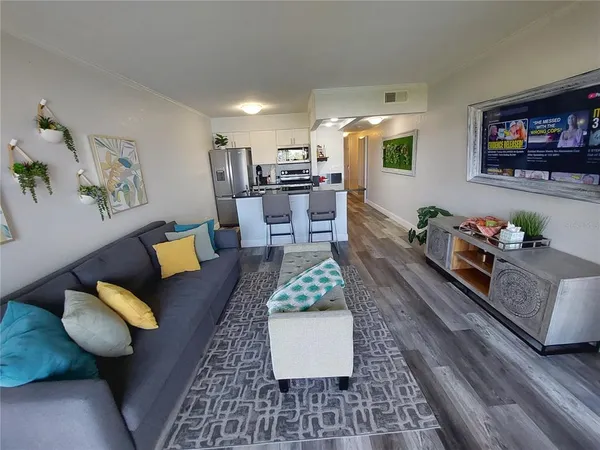 a living room with furniture and a rug