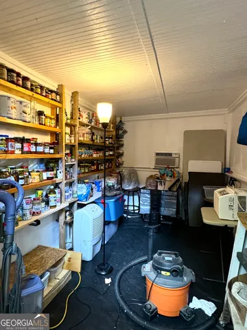 a backyard of a house with barbeque oven