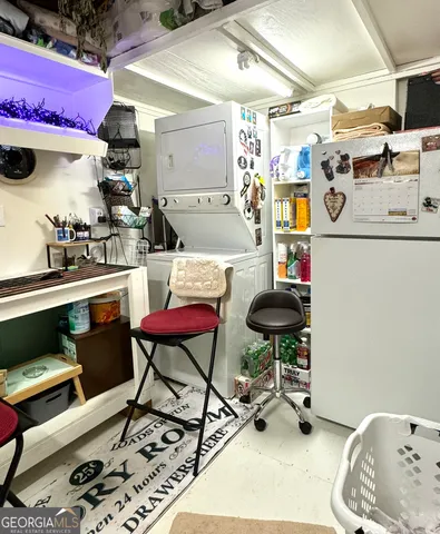 a utility room with games and windows