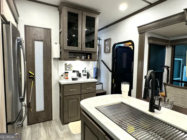 a kitchen with a sink and cabinets