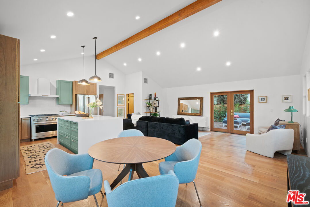 5252 Range View Avenue Los Angeles, CA 90042 - Photo 12 of 41 a living room with furniture kitchen view and a wooden floor