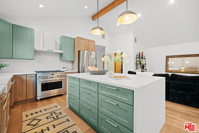a kitchen with a stove and a sink