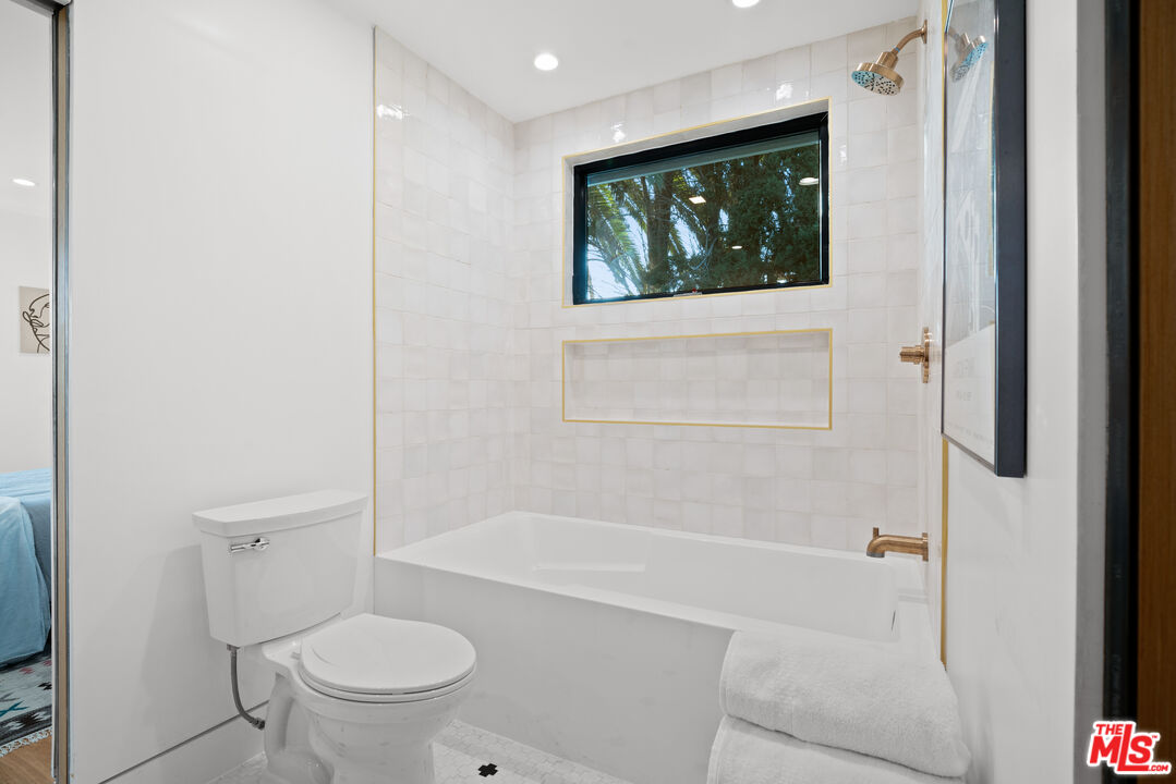 5252 Range View Avenue Los Angeles, CA 90042 - Photo 29 of 41 a bathroom with a toilet and a shower