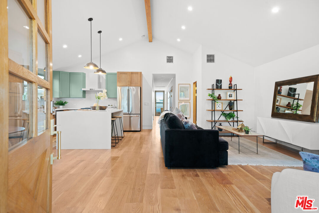 5252 Range View Avenue Los Angeles, CA 90042 - Photo 3 of 41 a living room with stainless steel appliances kitchen island granite countertop furniture and a wooden floor