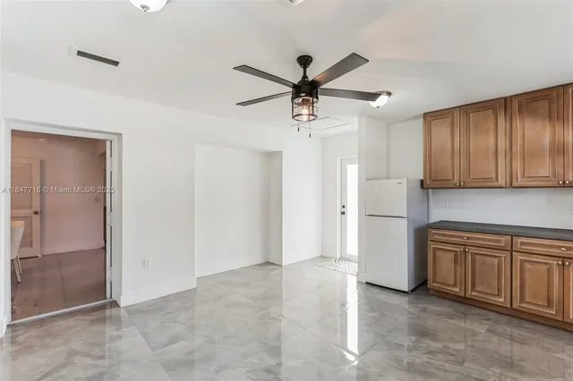 a view of a kitchen with a sink and dishwasher