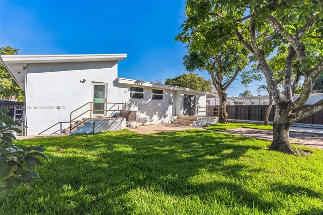 a front view of a house with swimming pool having outdoor seating