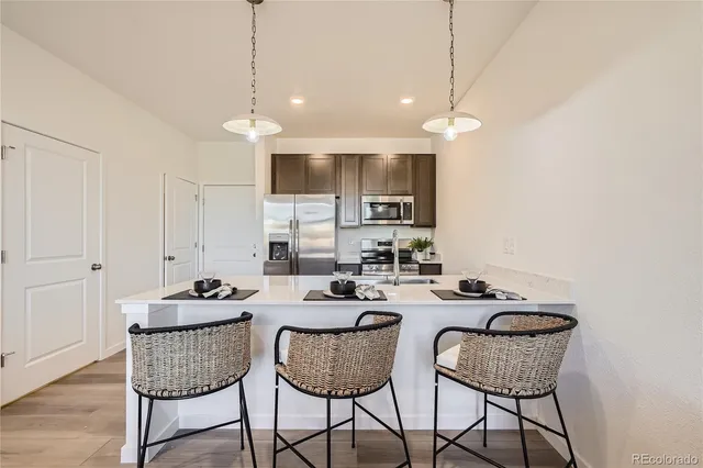 a dining room with furniture a window and kitchen view