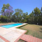 a view of a swimming pool with an outdoor space and seating area