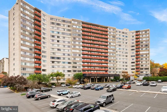 a city street filled with lots of tall buildings