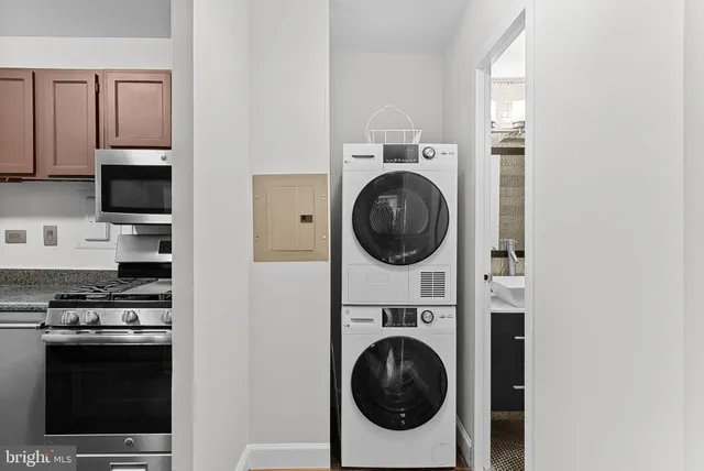 a view of kitchen sink and a stove top oven