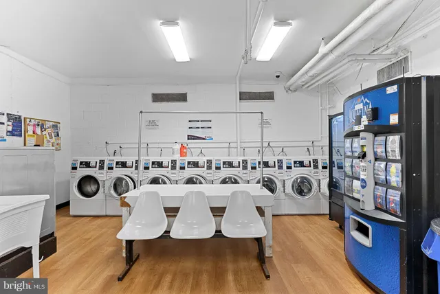 a view of a kitchen with dining table and chairs