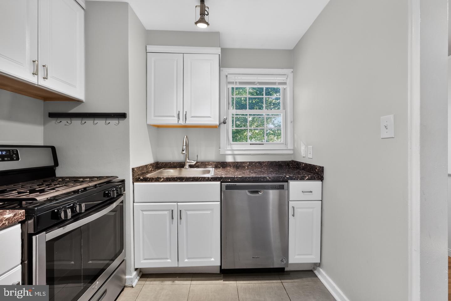 8329 Grubb Road, Unit G103 Silver Spring, MD 20910 - Photo 7 of 24 Modern kitchen with sleek finishes.
