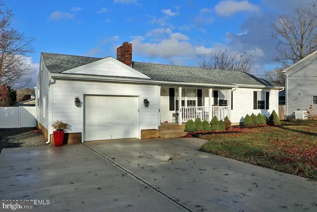 a front view of a house with a garage