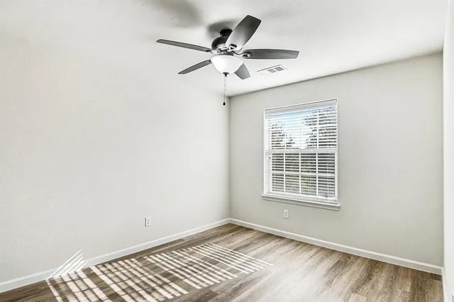 a bathroom with a double vanity sink and mirror