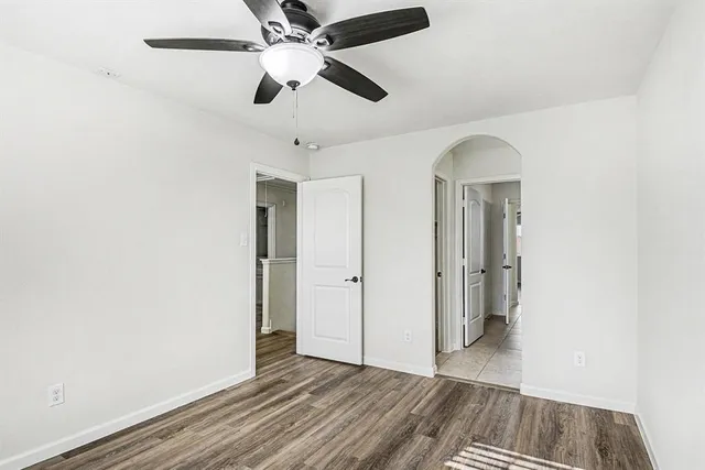 a bathroom with a tub shower vanity and a sink