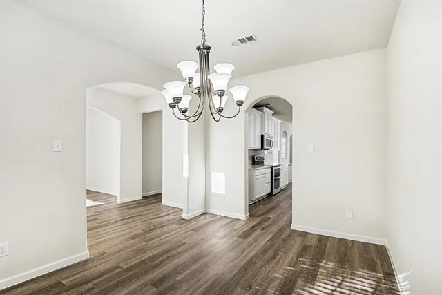 a view of a livingroom with wooden floor