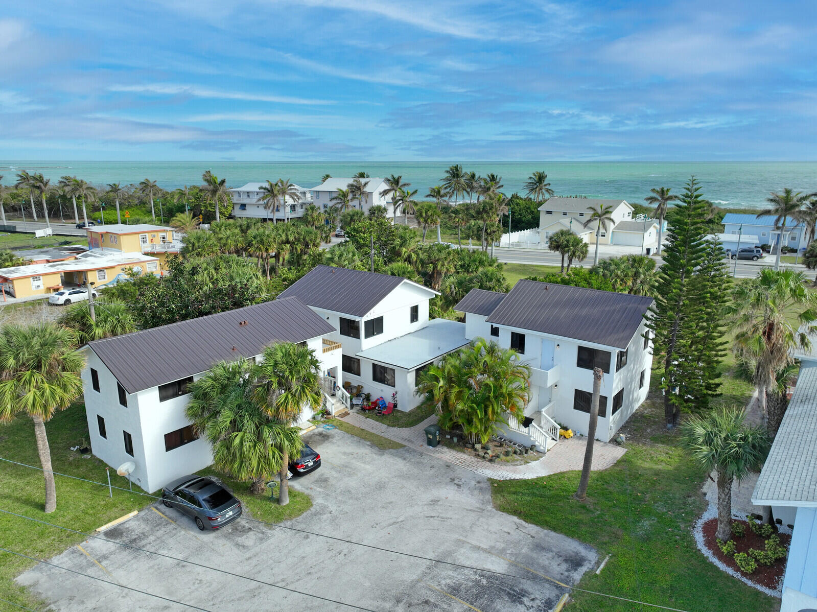 652 Hernando Street, Unit C Fort Pierce, FL 34949 - Photo 11 of 18 a view of a garden with an buildings and a yard