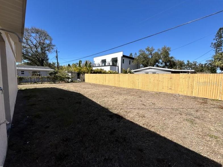 2345 Floyd Street Sarasota, FL 34239 - Photo 16 of 18 a view of a swimming pool with an outdoor seating and a yard