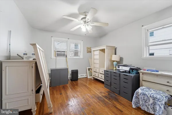 a view of a workspace with furniture and a bedroom