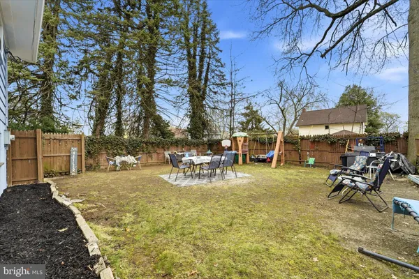 a view of a yard with table and chairs