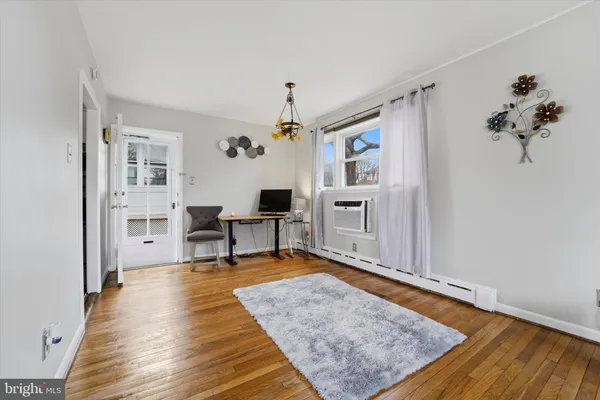 a living room with furniture and a rug