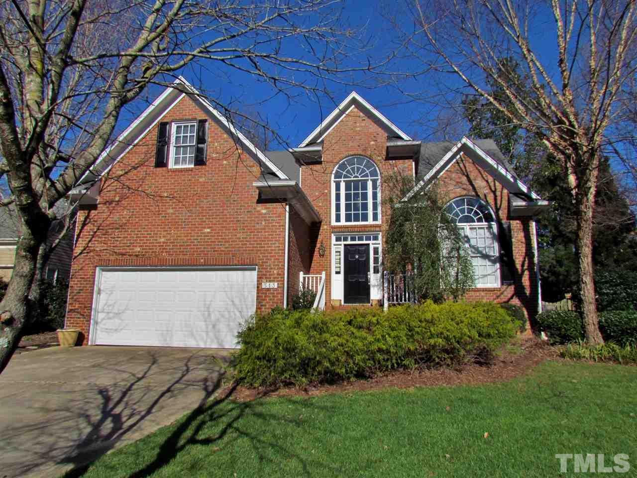 513 Tufts Court Raleigh, NC 27609 - Photo 1 of 25 a front view of a house with a yard and garage