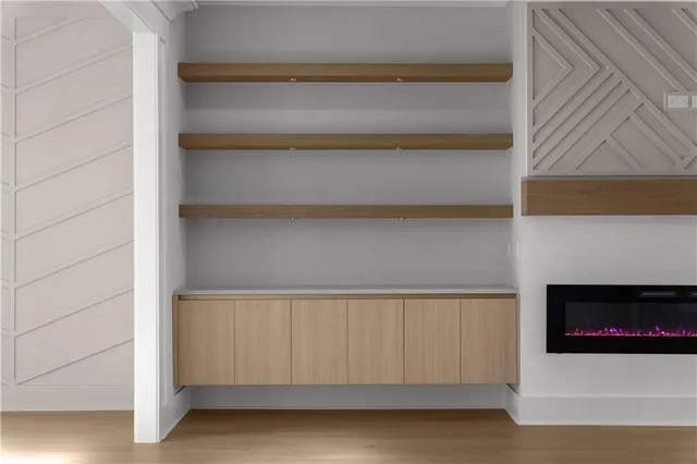 a bathroom with a granite countertop sink and mirror