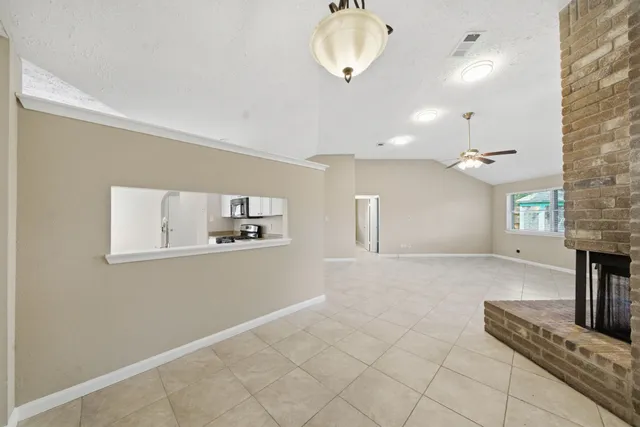 a view of a kitchen with a sink and chandelier