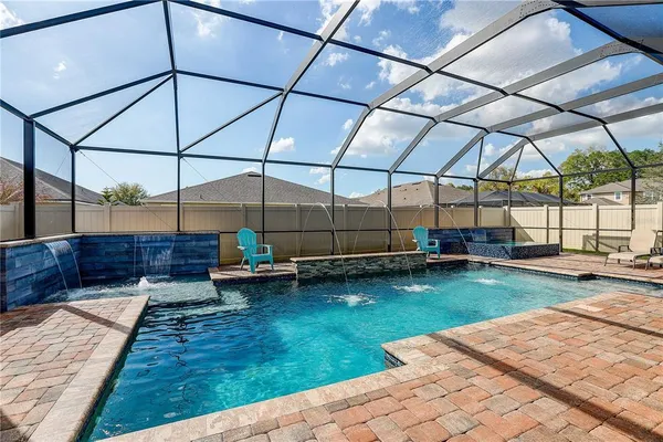 a view of a swimming pool with a yard