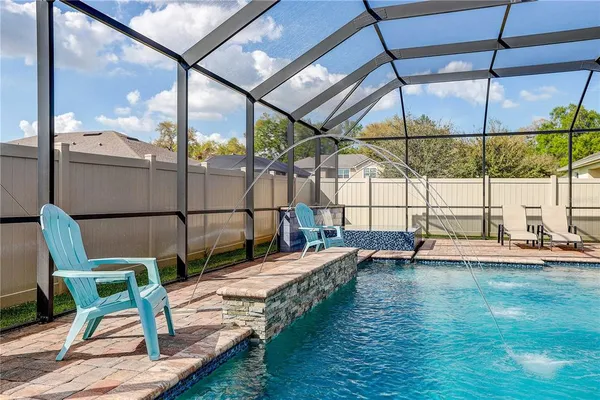 a view of backyard with sitting area
