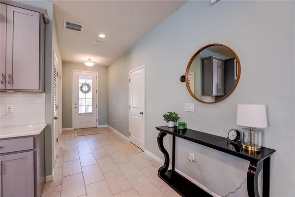 a spacious bedroom with a bed and a window