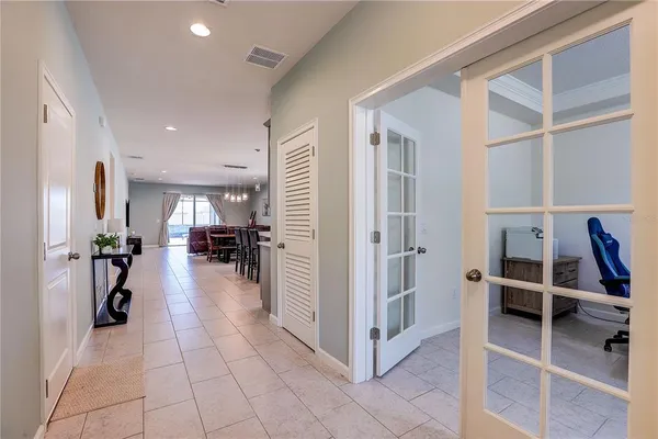 a bedroom with a large bed and a flat screen tv