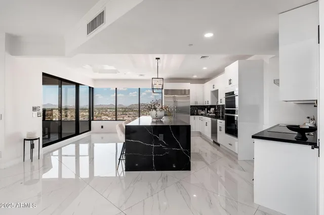 a kitchen with a sink and refrigerator