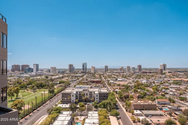 a bedroom with furniture and a flat screen tv