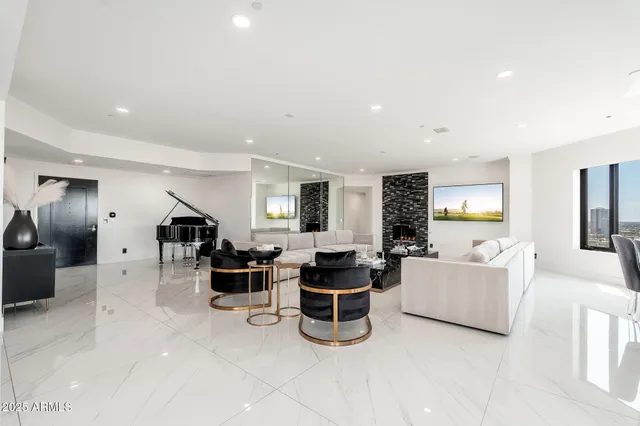 a living room with furniture and a large window