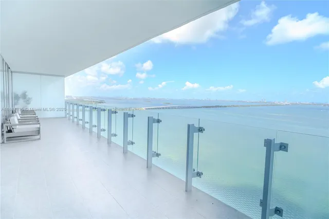 a view of a hallway with windows