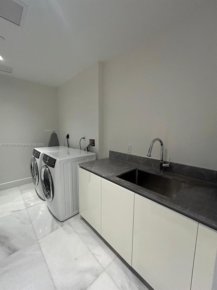 700 Northeast 26th Terrace, Unit 2602 Miami, FL 33137 - Photo 15 of 38 a kitchen with a sink and cabinets