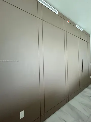 a bathroom with a shower and a shower