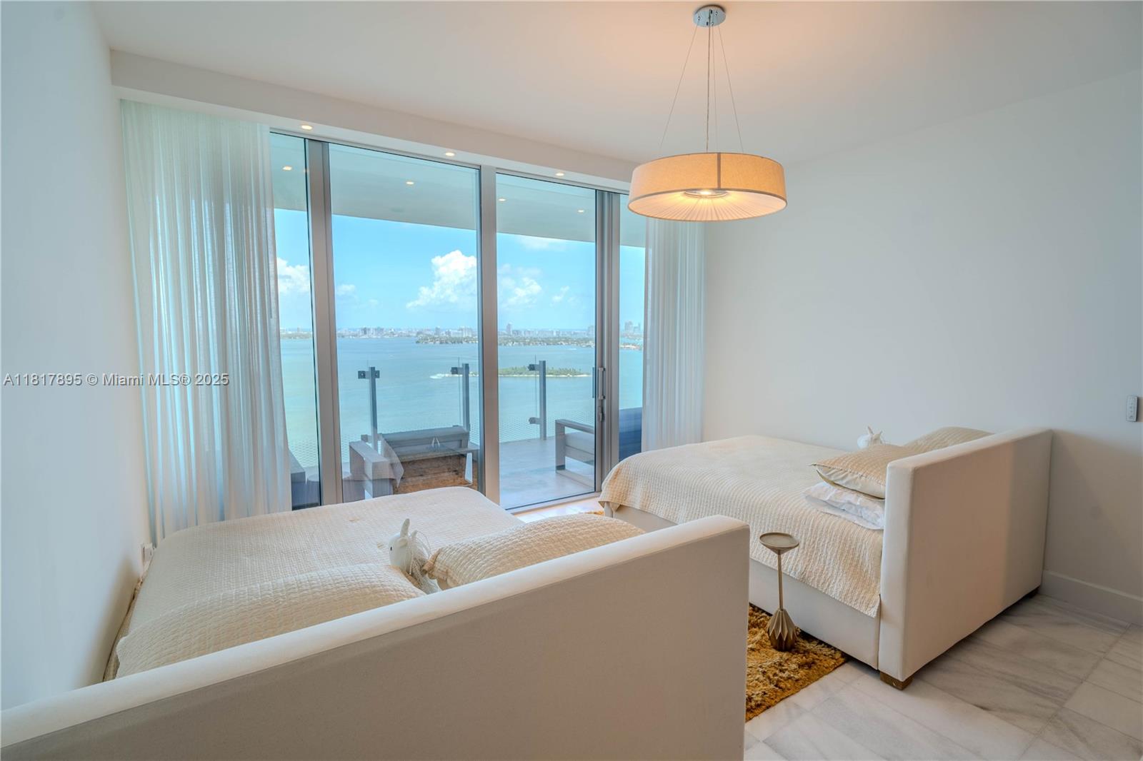 700 Northeast 26th Terrace, Unit 2602 Miami, FL 33137 - Photo 25 of 38 a living room with furniture and a large window