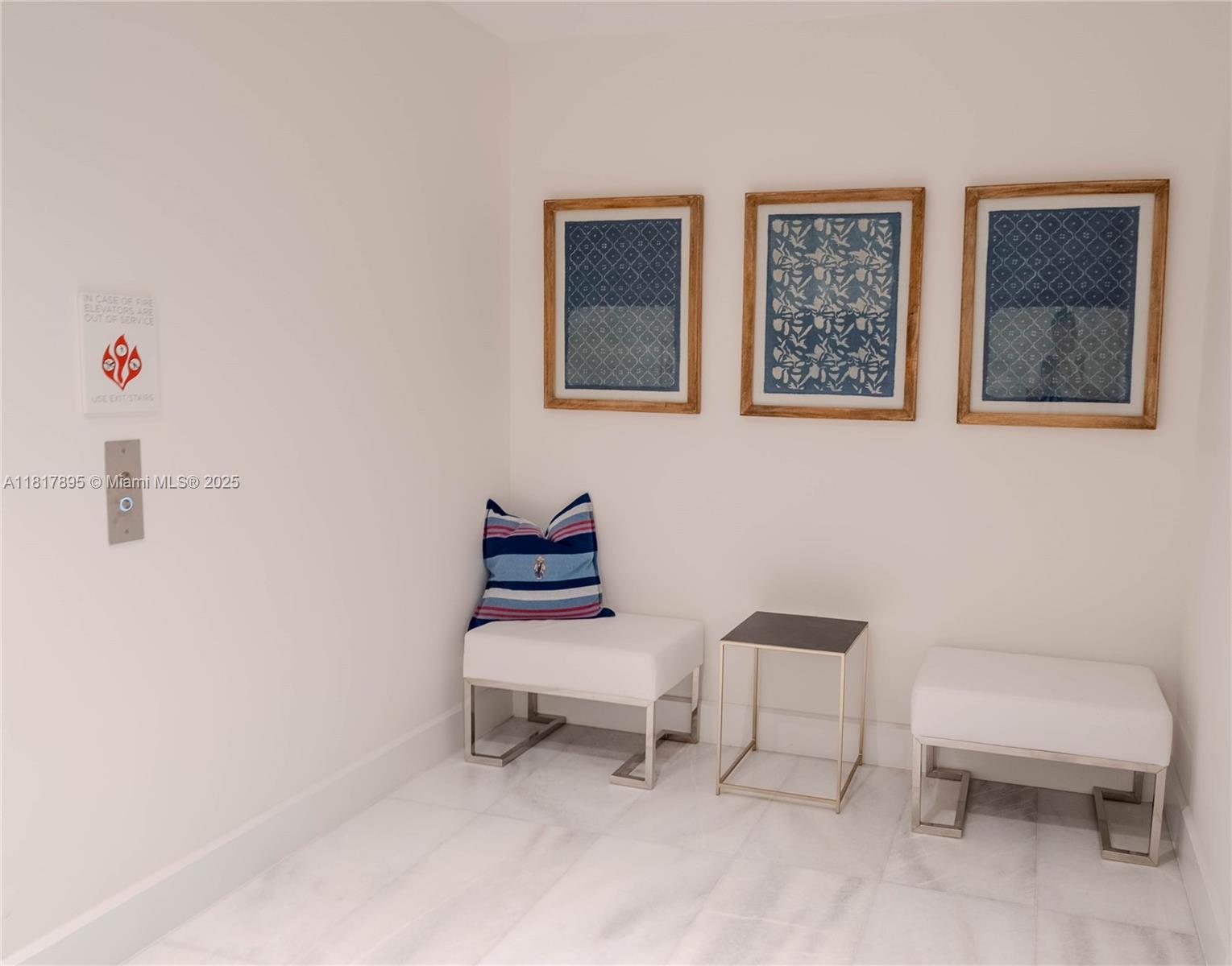 700 Northeast 26th Terrace, Unit 2602 Miami, FL 33137 - Photo 5 of 38 a living room with furniture and a chair