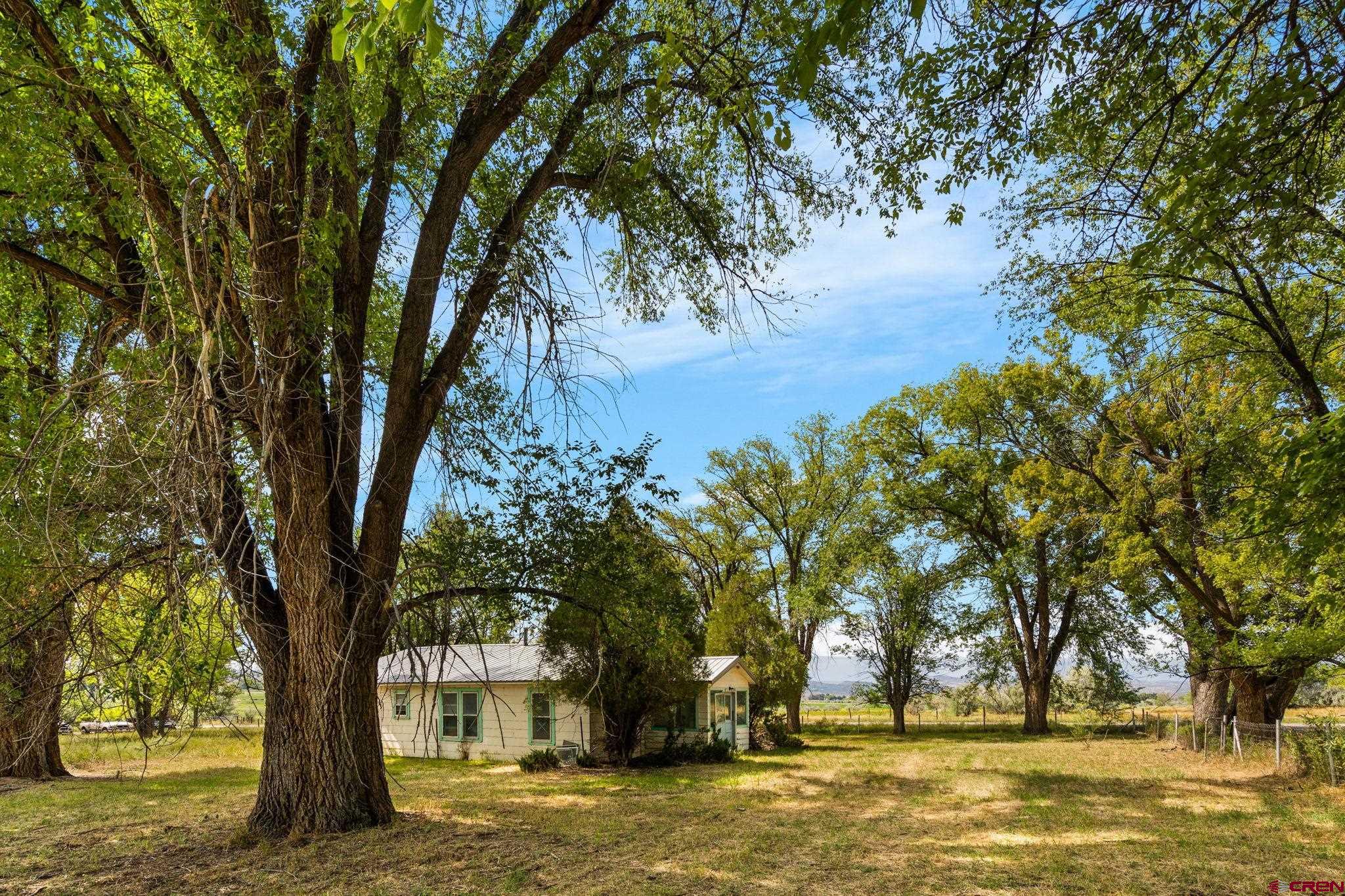 a view of a large body of water with a house