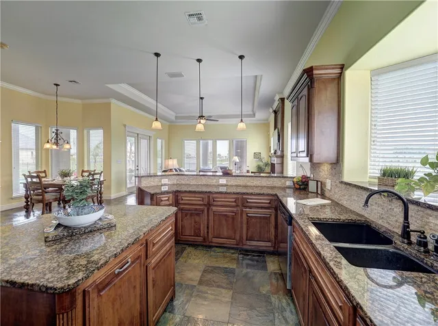 a kitchen with lots of counter top space and living room