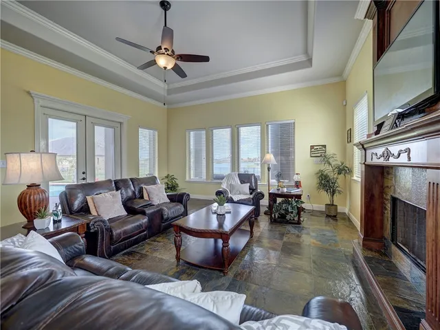 a living room with furniture and a fireplace