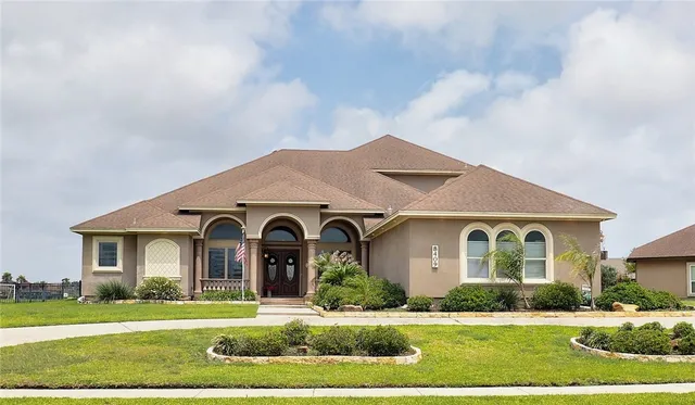 a front view of a house with a yard