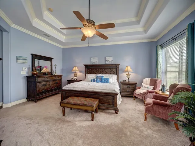 a bedroom with bed and window