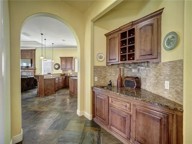 a view of a kitchen with a sink and cabinets