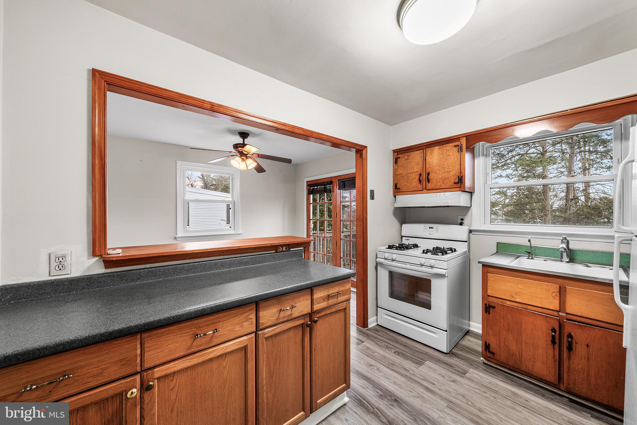 1108 Providence Road Secane, PA 19018 - Photo 14 of 33 a kitchen with stainless steel appliances granite countertop a stove a sink and a refrigerator