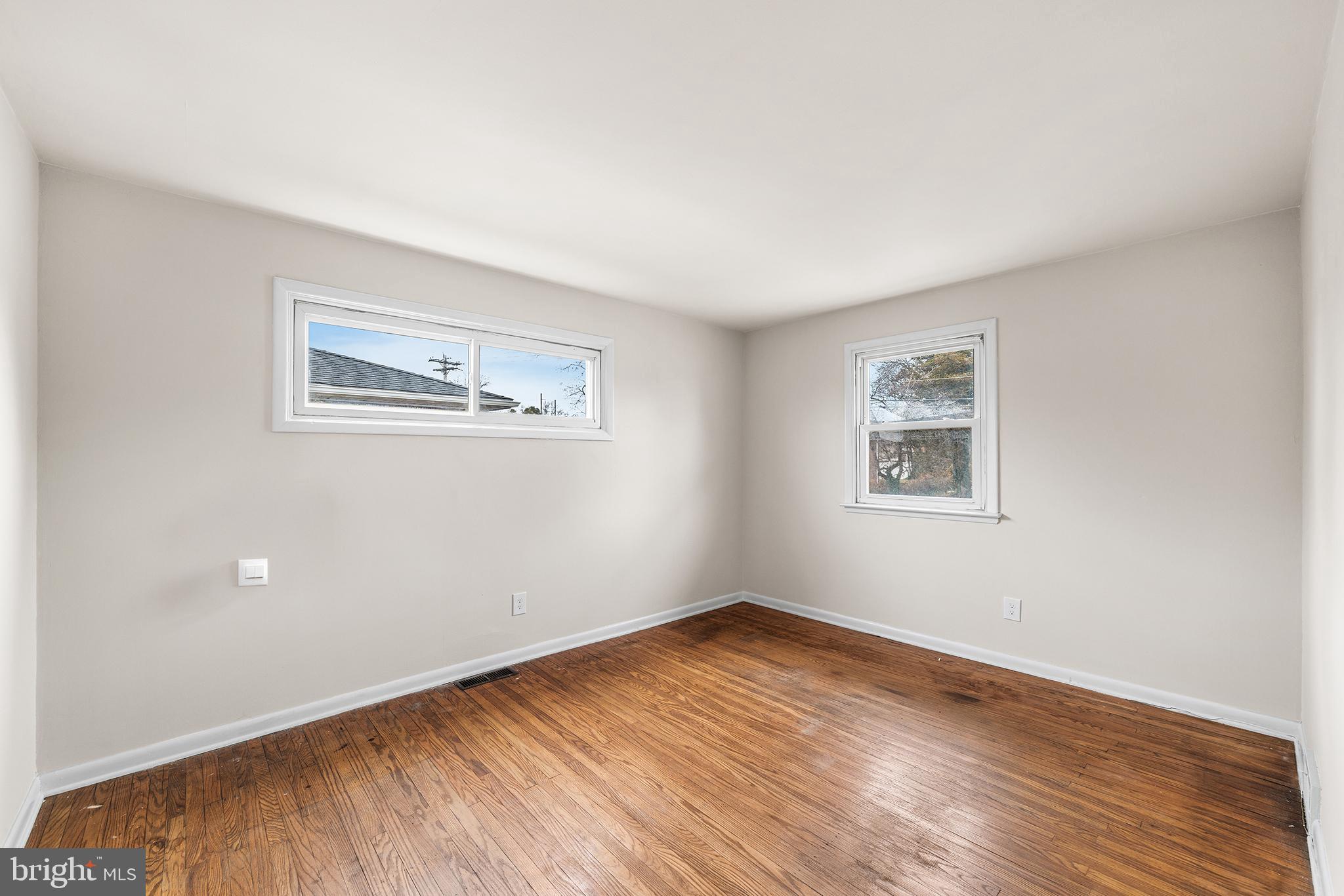 1108 Providence Road Secane, PA 19018 - Photo 15 of 33 a view of a room with wooden floor and window