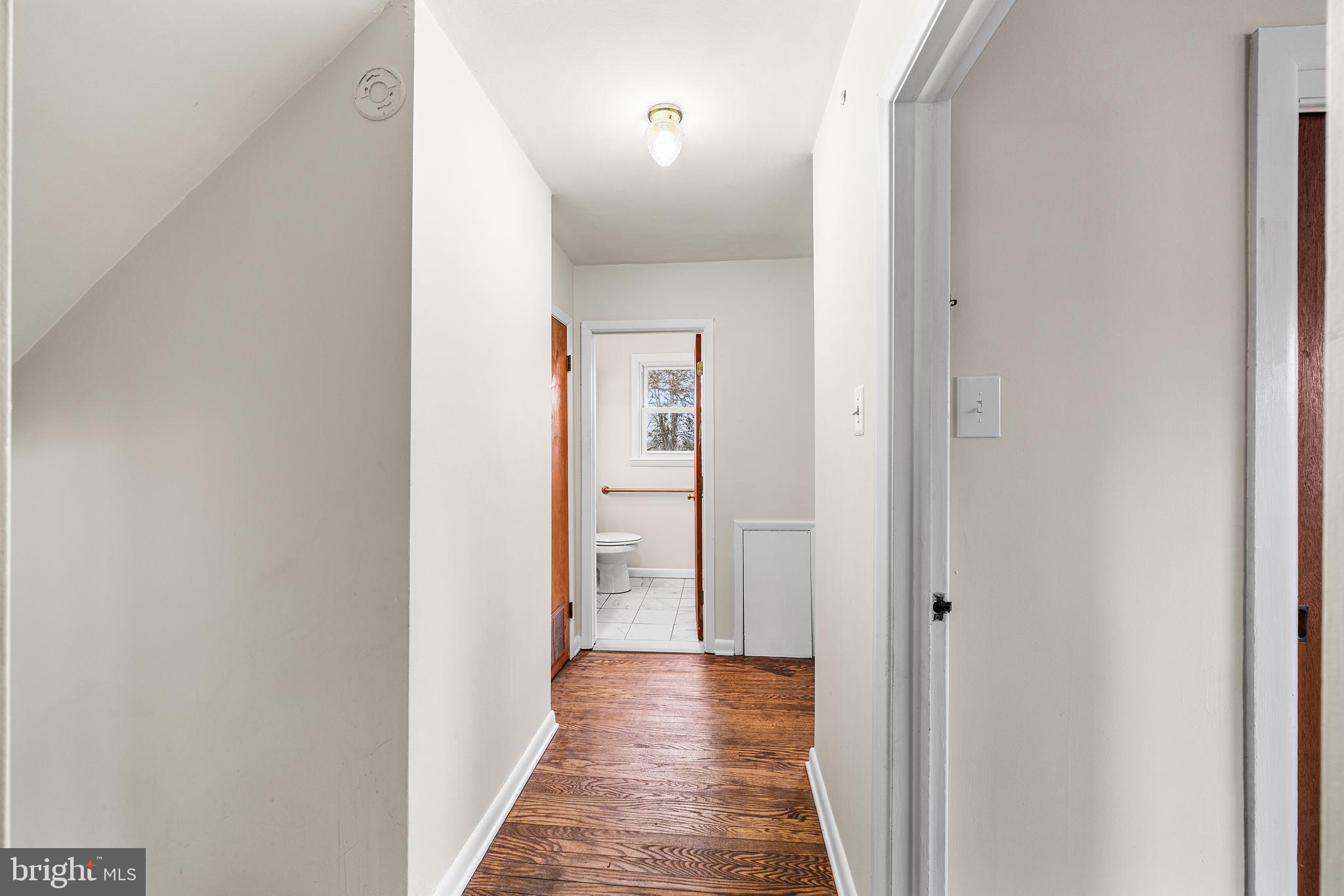 1108 Providence Road Secane, PA 19018 - Photo 17 of 33 a view of a hallway with wooden floor
