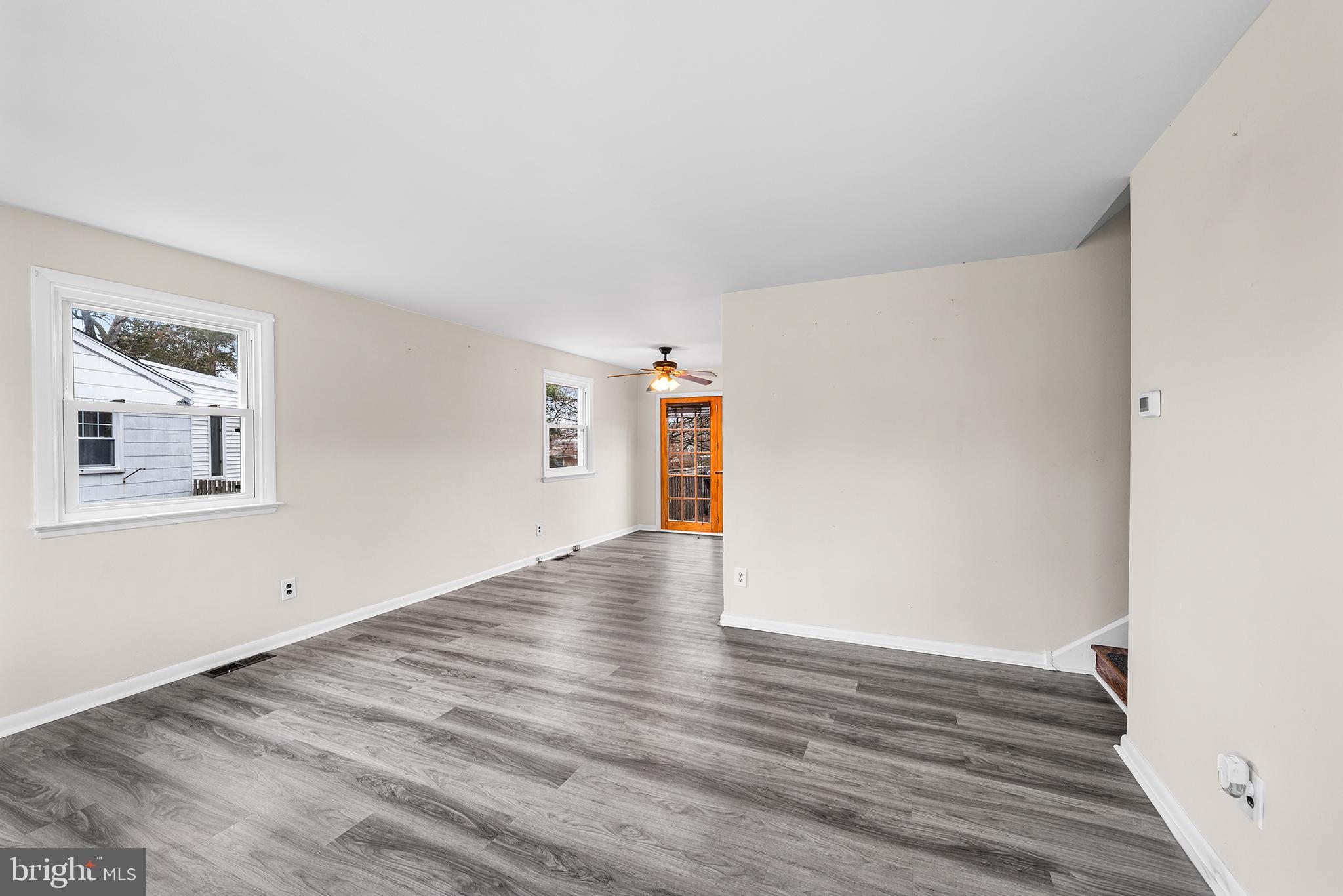 1108 Providence Road Secane, PA 19018 - Photo 4 of 33 a view of an empty room with wooden floor and a window